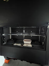 Ample storage in this RV rental's organized rear compartment, featuring shelves & bins for adventure essentials.