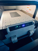 Portable fridge displaying 32F, providing essential refrigeration for an RV rental adventure.