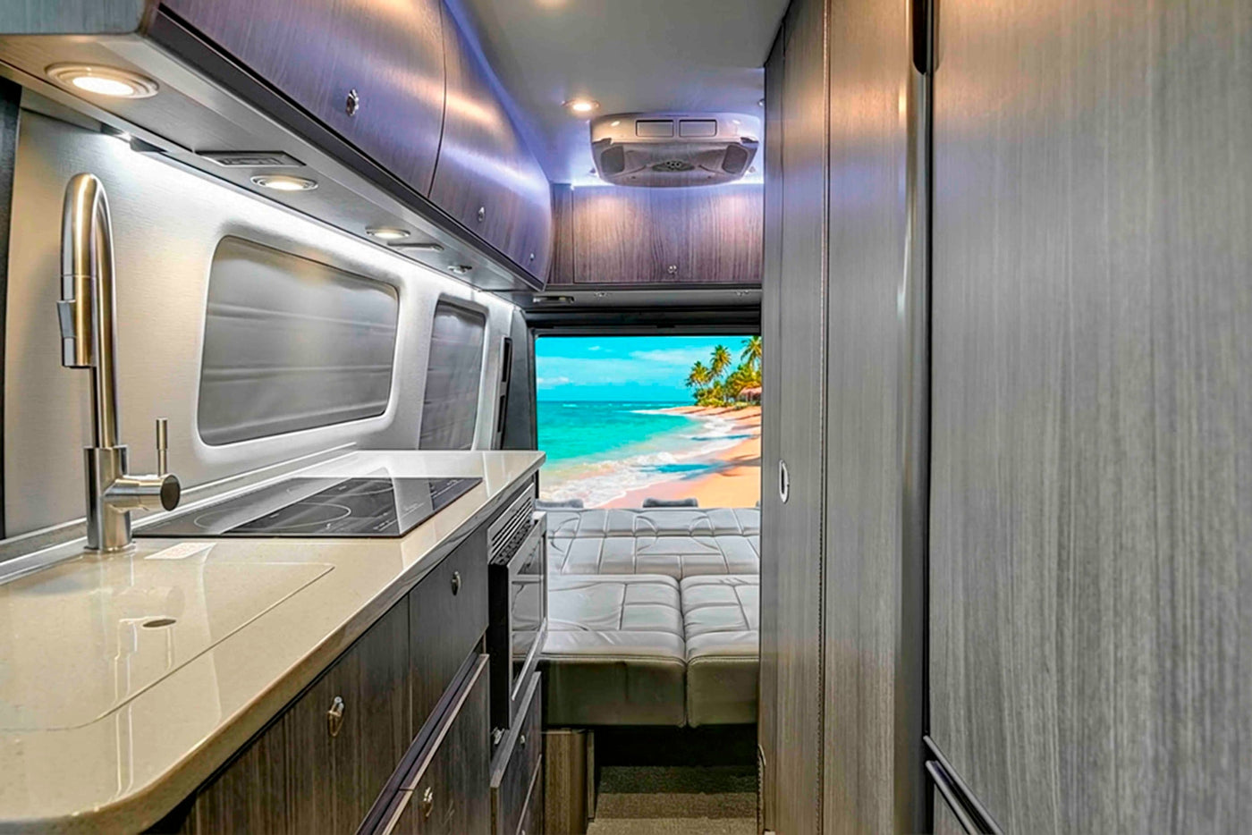  and front cabin seats in this modern interior.|Dark gray Mercedes-Benz Sprinter luxury van — photo 11