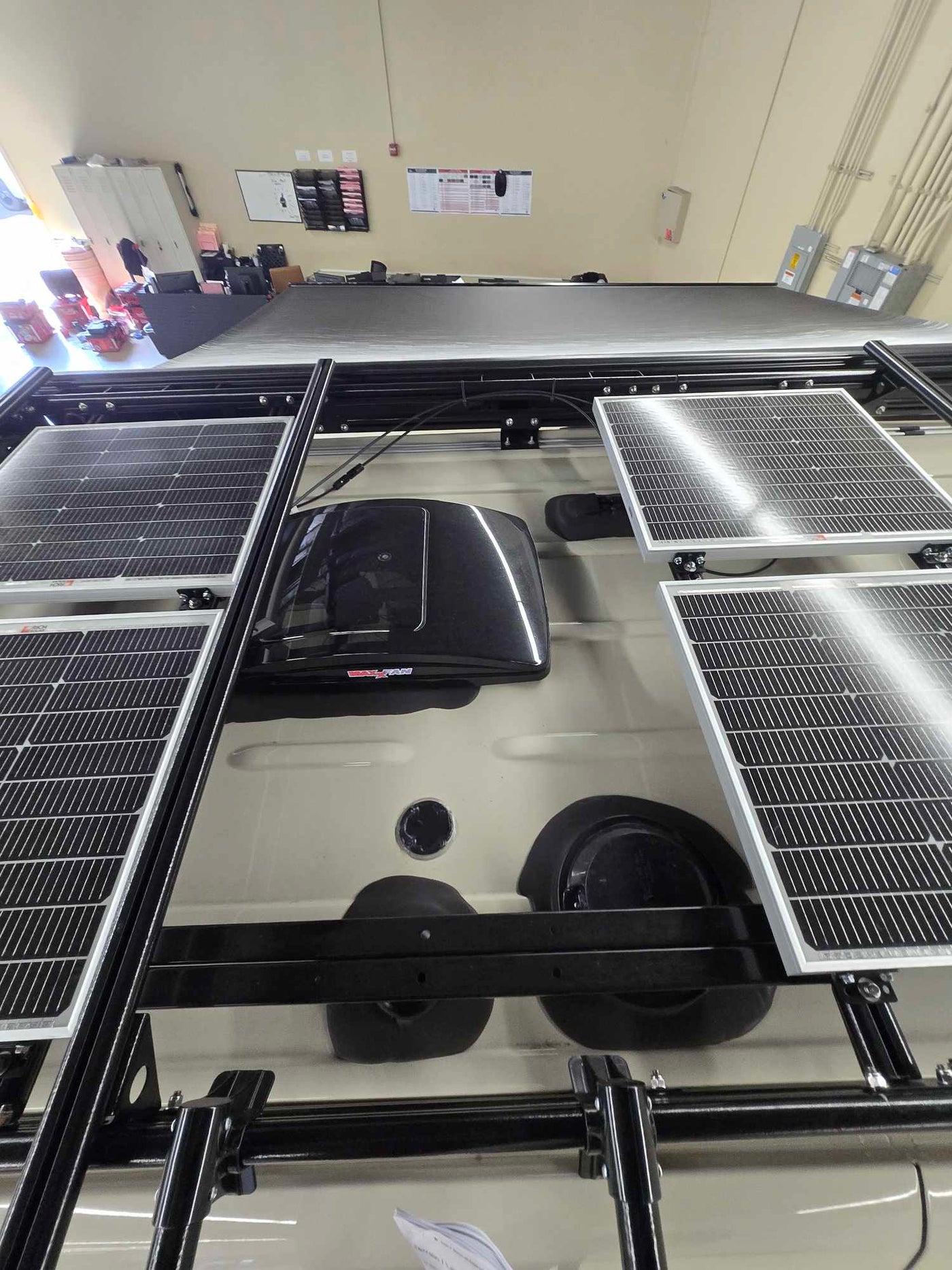  and overhead storage bin.|RV rental interior showcasing a compact kitchen — photo 17