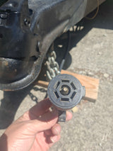 Essential 7-pin RV electrical connector for trailer lights and brakes, seen with a hitch. Ideal for any rv rental.