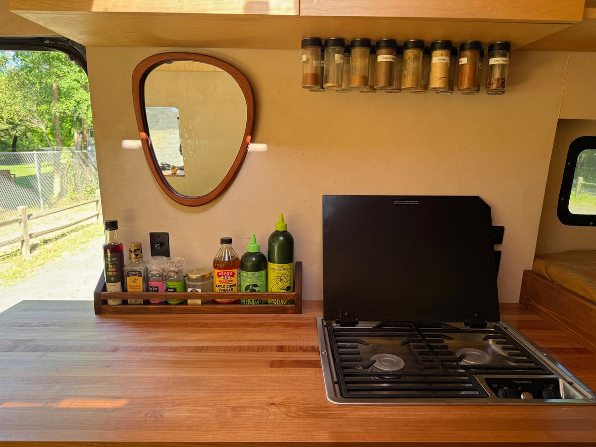  and cozy bed.|Step into this rv rental's cozy interior: a full kitchenette — photo 3