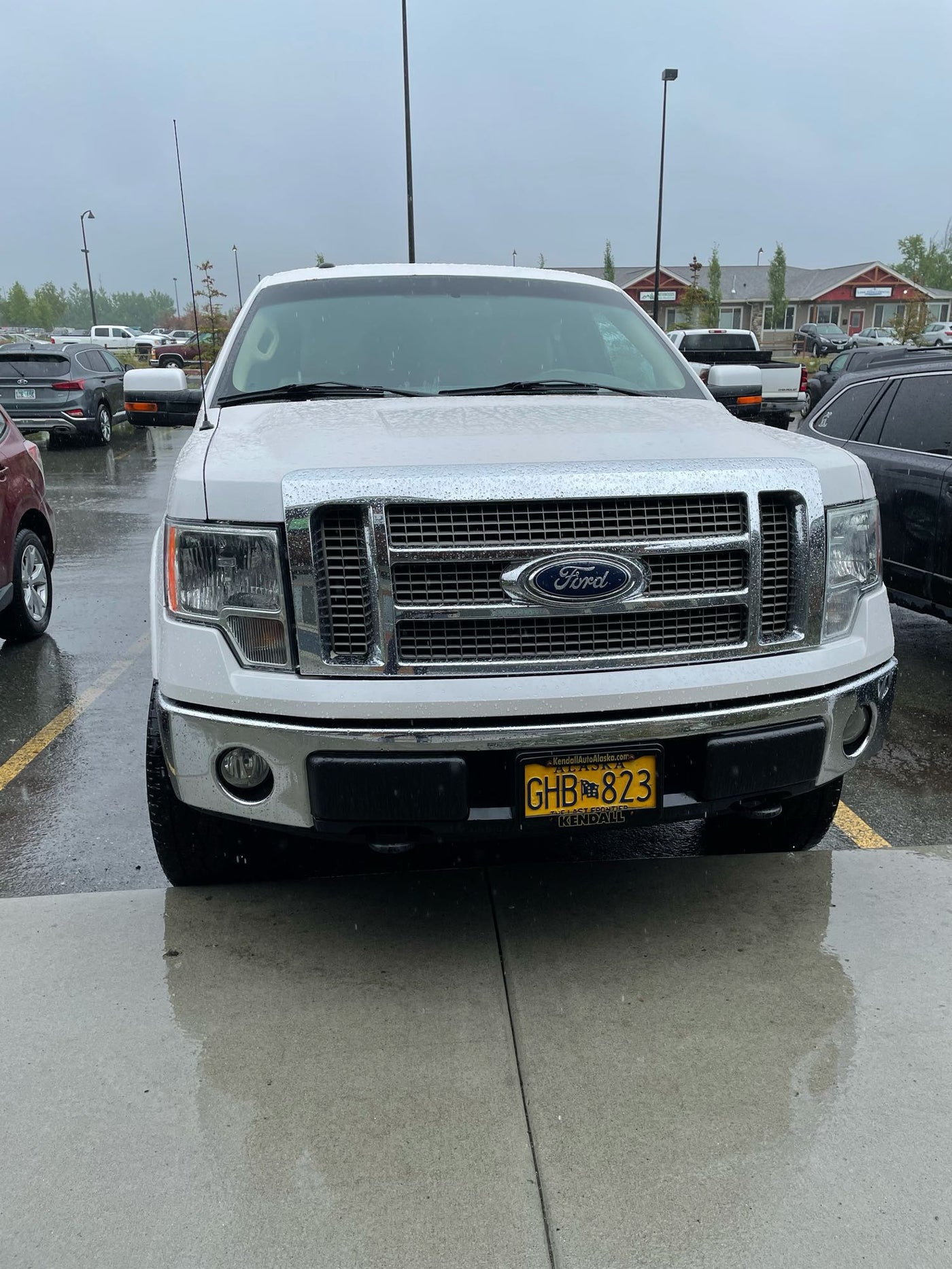  parked. Great RV rental alternative for adventures.|White Ford F-150 4x4 pickup with camper shell — photo 3