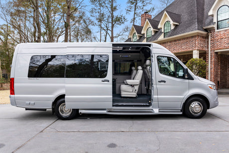 This custom Mercedes-Benz Sprinter luxury van, perfect for RV rental, showcases its spacious, open interior.