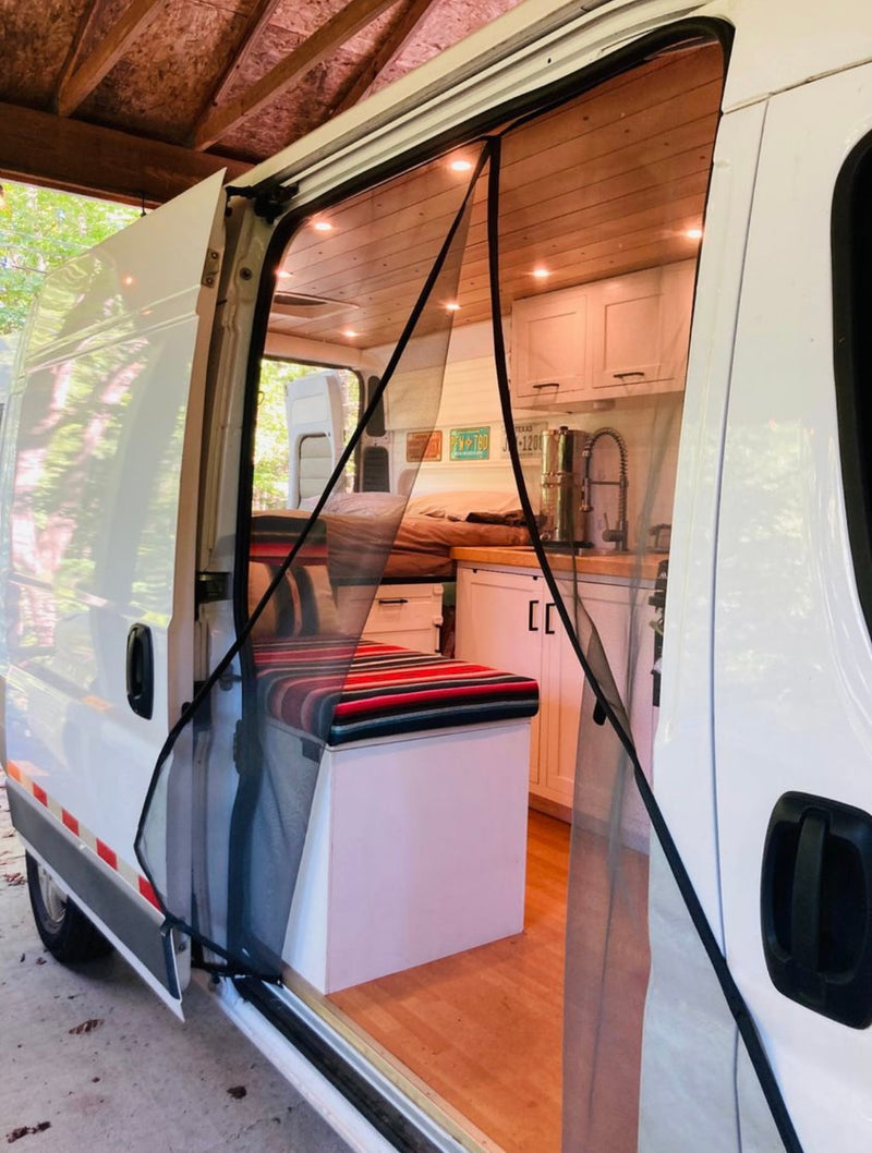 Bright RV rental camper van interior: open side door with magnetic screen — photo 1