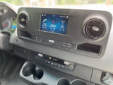 Modern rv rental dashboard featuring an infotainment screen with navigation, phone, and SiriusXM radio, plus climate controls.