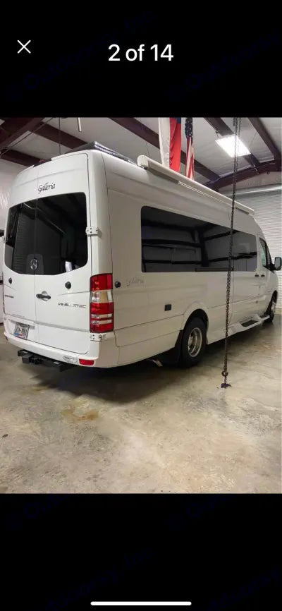  and overhead cabinets.|RV rental interior: compact kitchen area with microwave — photo 6