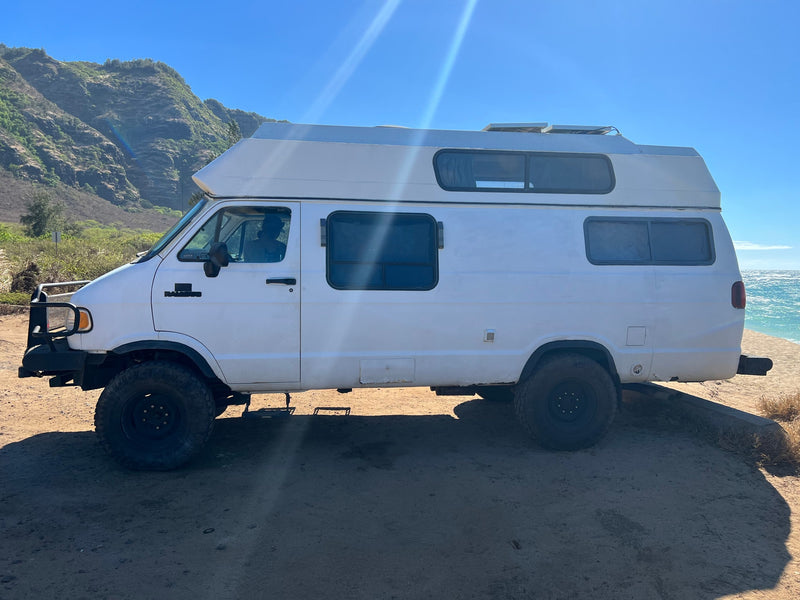  parked by the Hawaiian ocean. Perfect for coastal adventures.|This white — photo 7