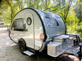 Sleek gray nuCamp Boondock LITE teardrop camper, perfect for your next rv rental outdoor escape.