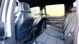 Spacious rear truck interior with versatile seating and storage, great for an RV rental. Ready for your next travel adventure!