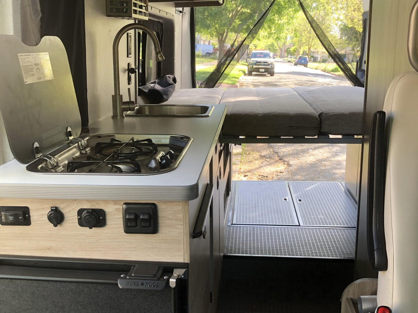  and mirrored door.|RV rental interior featuring comfy seating — photo 5