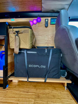 RV rental interior with an Ecoflow portable power station & cooler on custom storage, ready for van life adventures.