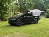Tesla Cybertruck with a pop-up tent camper
