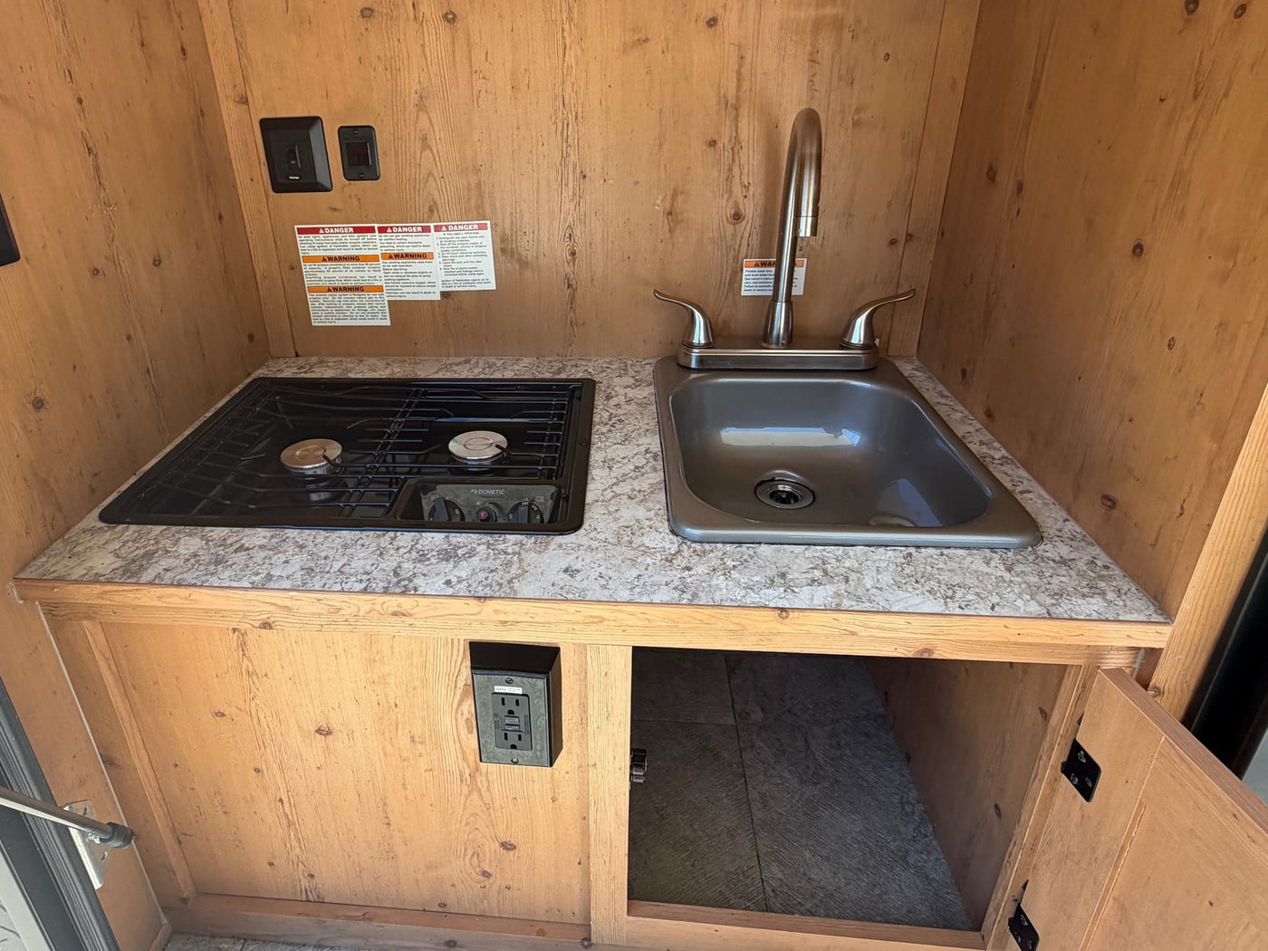  ready for off-grid adventure.|Vibrant orange & black SunRay Sport travel trailer — photo 11