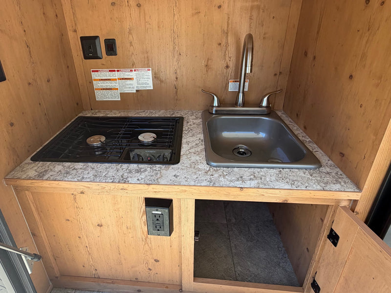  ready for off-grid adventure.|Vibrant orange & black SunRay Sport travel trailer — photo 11