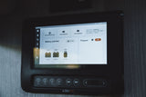 This RV rental's digital control panel displays generator status, battery voltage, and propane levels for easy monitoring.