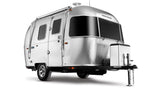 A sleek silver Airstream travel trailer, an ideal RV rental, showcasing its iconic rounded design and large black windows.