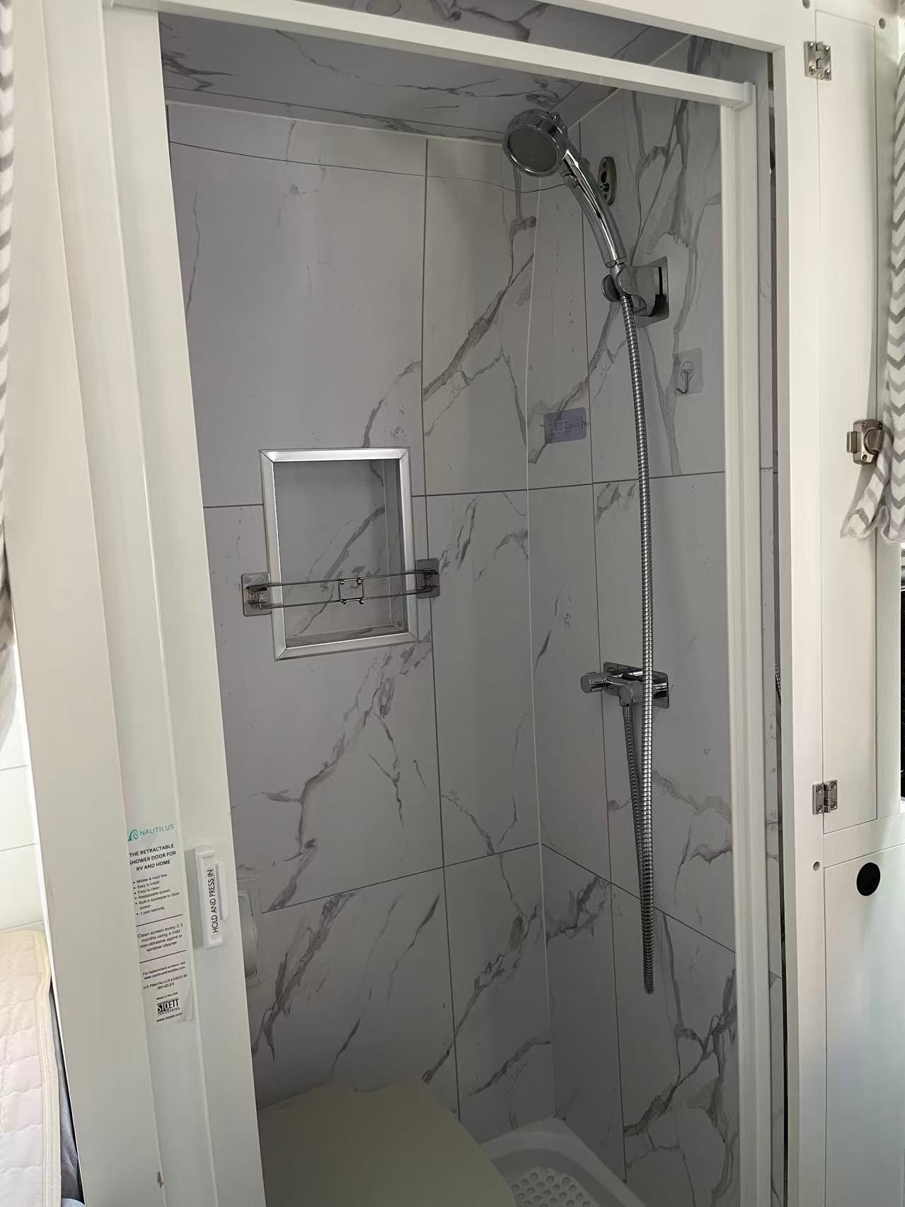  and picturesque outdoor views from the back windows.|Modern RV rental kitchen features a stylish gooseneck faucet — photo 4