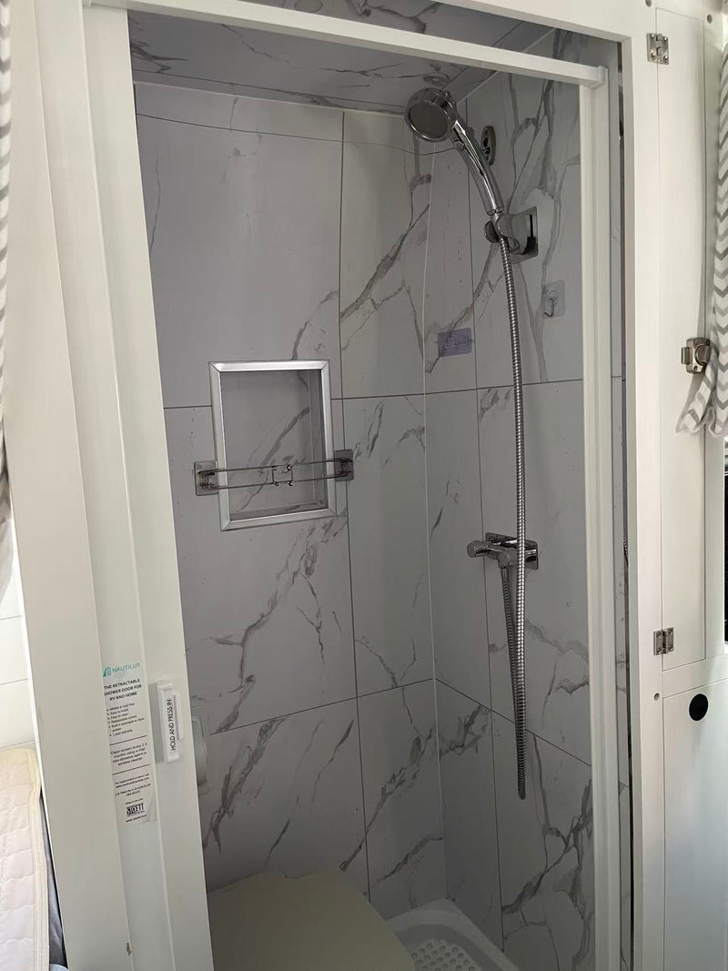  and picturesque outdoor views from the back windows.|Modern RV rental kitchen features a stylish gooseneck faucet — photo 4