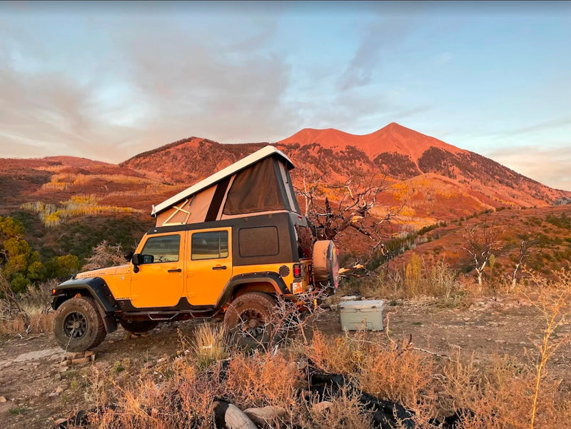 Fall overlanding in a yellow Jeep with pop-top tent — photo 1