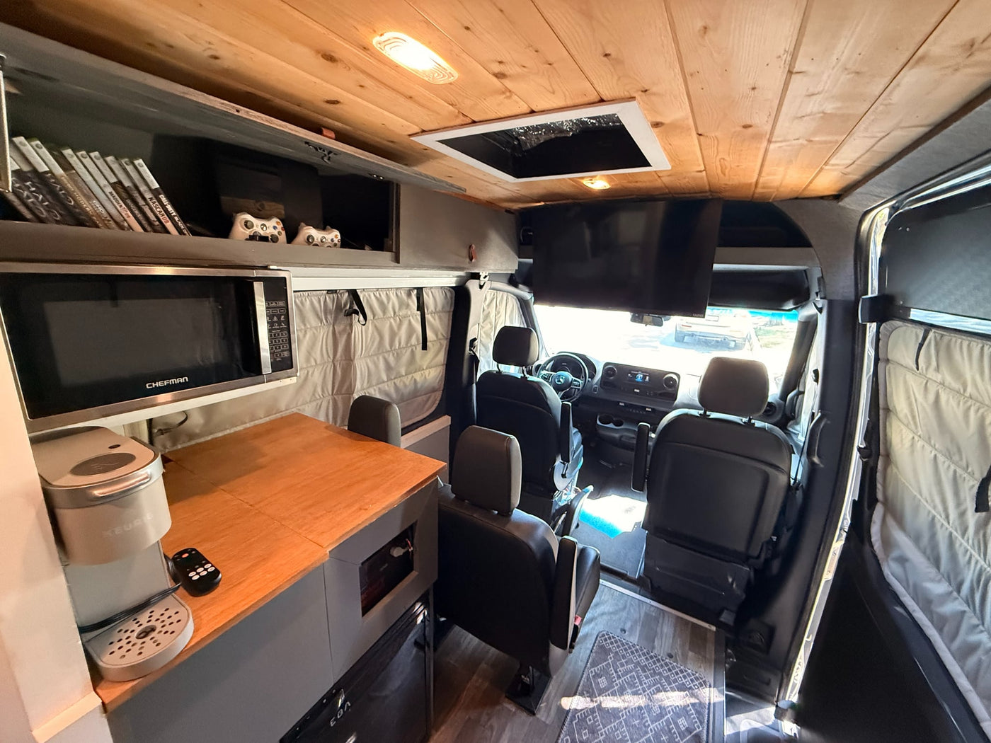  and bikes ready for outdoor adventure.|RV rental van with two mountain bikes on the back — photo 3