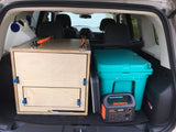 SUV car camping setup: custom storage, water, cooler, Jackery power. Great for road trips, an RV rental adventure.
