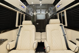 Experience comfort in this luxury RV rental interior. Plush cream captain's chairs, blackout blinds, and a rear TV.