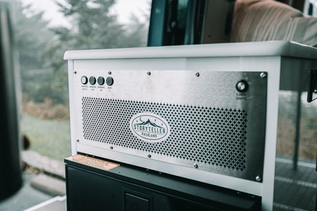 This rv rental features a Storyteller Overland control panel with buttons for awning lights, awning, and cabin lights.