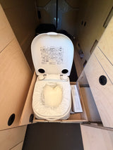 Composting toilet in an rv rental, open with a plastic liner & instructions on the lid, for practical and clean use.