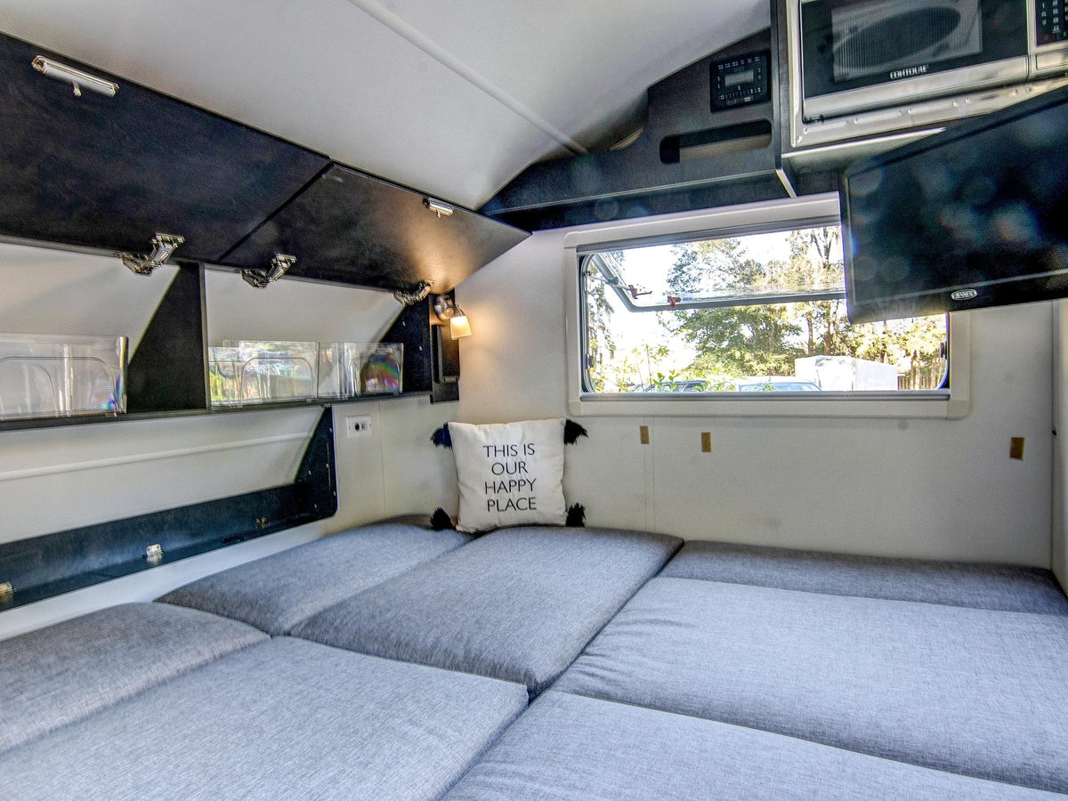  and scenic window.|Cozy rv rental interior: L-shaped sofa — photo 17