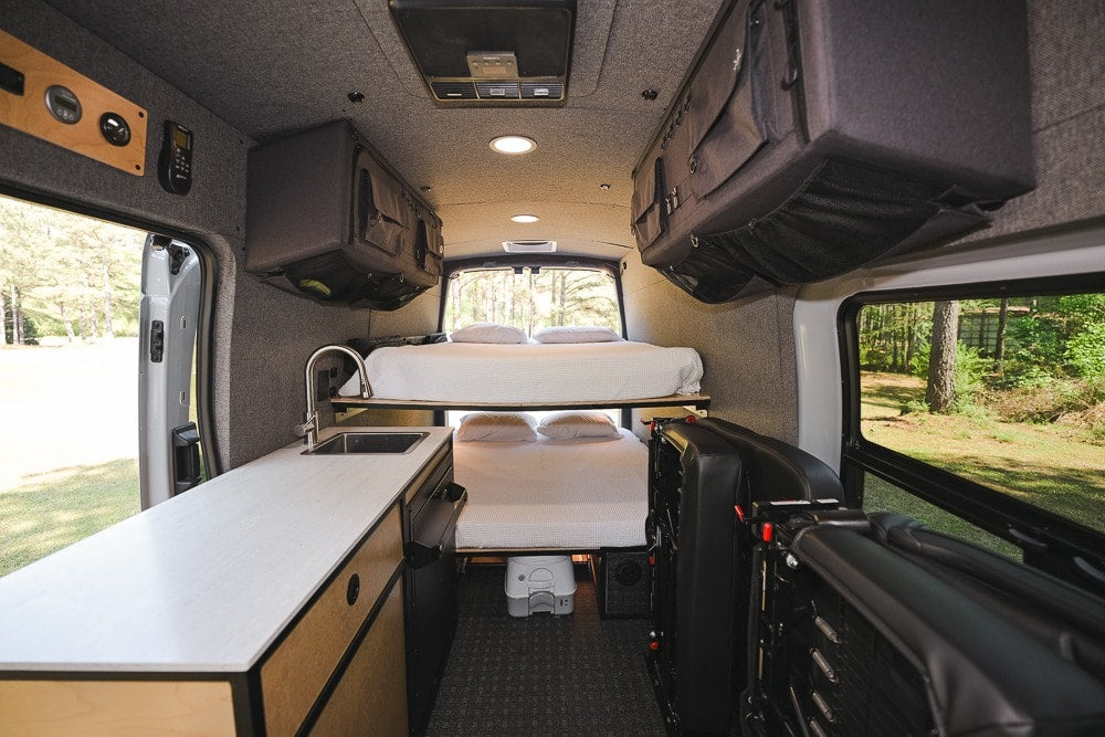  and overhead storage. Ideal for comfortable travel & adventures.|This RV rental interior offers bunk beds — photo 6