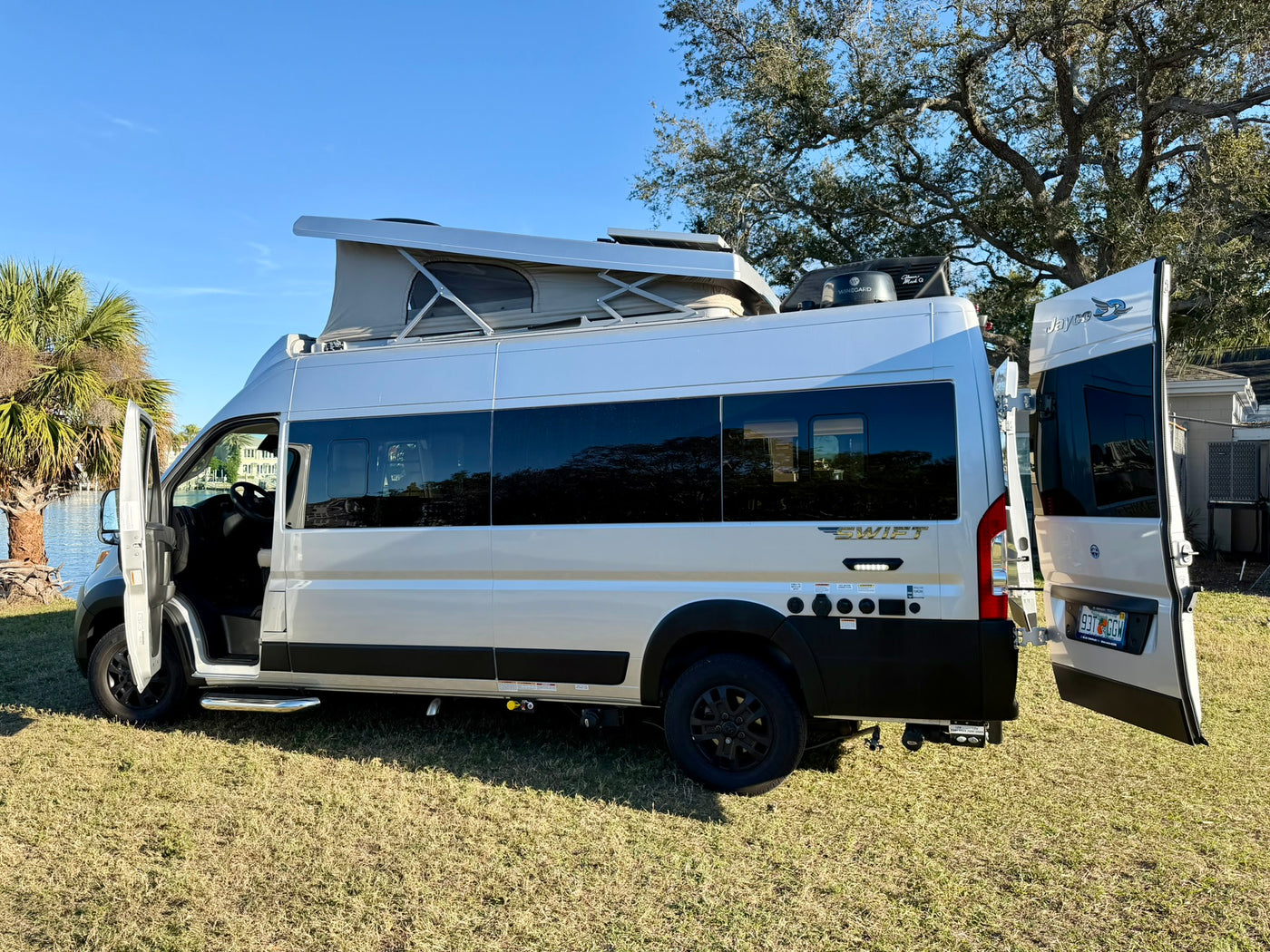  and ample storage. Perfect for travel.|Inside a cozy rv rental: a comfy bed — photo 5
