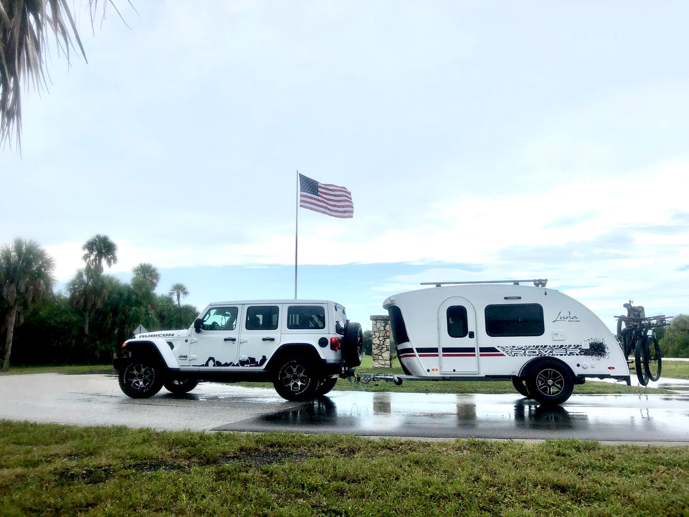  set against an American flag. Perfect for road trips.|This teardrop camper