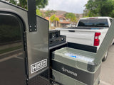 This Hiker Trailer RV rental features an accessible Truma cooler, perfect for any outdoor adventure or camping trip.