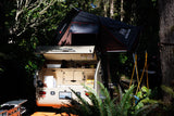  perfect for camping in nature.|RV rental's open tailgate reveals a compact outdoor kitchen with stove