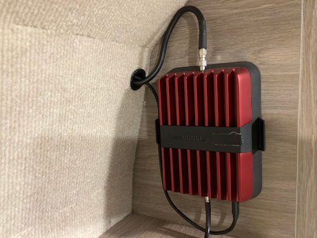 A weBoost cell signal booster installed in an rv rental, improving connectivity on the go.