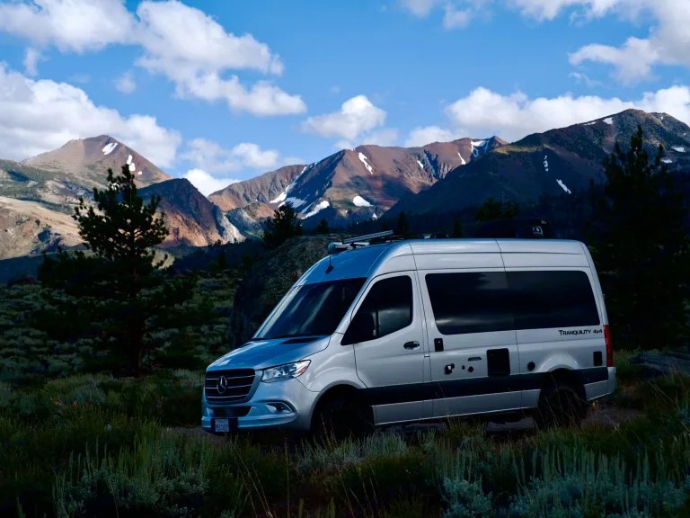  ideal for outdoor adventures.|Experience adventure in this RV rental! Features a compact kitchen with stove — photo 3