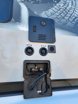 This RV rental's exterior utility panel features a water heater, city and fresh water connections, and a convenient outdoor shower.