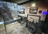 This off-road camper RV rental features a robust outdoor kitchen setup, perfect for adventurous camping.