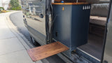 RV rental with a handy pull-out side table, showcasing custom camper van interior for outdoor convenience and comfort.