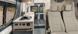 Modern rv rental interior: kitchen, comfortable front seats, and scenic outdoor views from camper van.