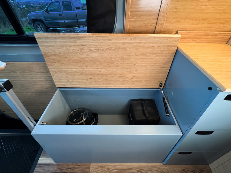  and microwave. Light wood design.|RV rental kitchen featuring microwave — photo 9