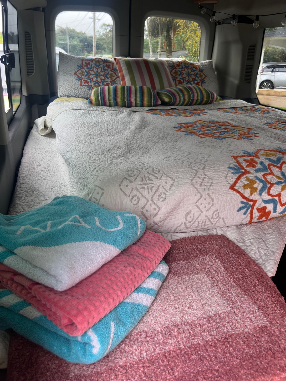  and beautiful tropical camper van view.|This RV rental features a Dometic two-burner camper stove with a raised cover — photo 12