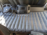 RV rental's front cab transformed into a comfortable sleeping area with an inflated Luno air mattress, perfect for camping.