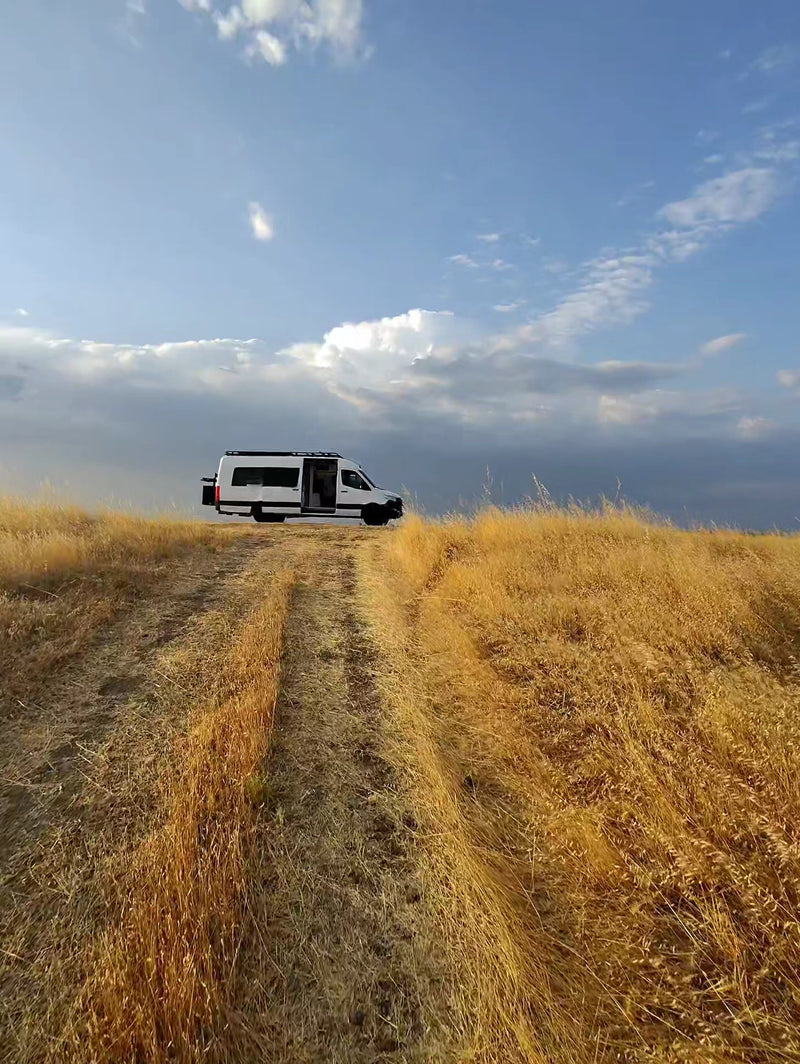  perfect for remote work.|Modern RV rental kitchen with white cabinets — photo 6