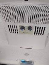 RV rental climate control unit: A Dometic air conditioner and heater with adjustable settings visible on the ceiling.