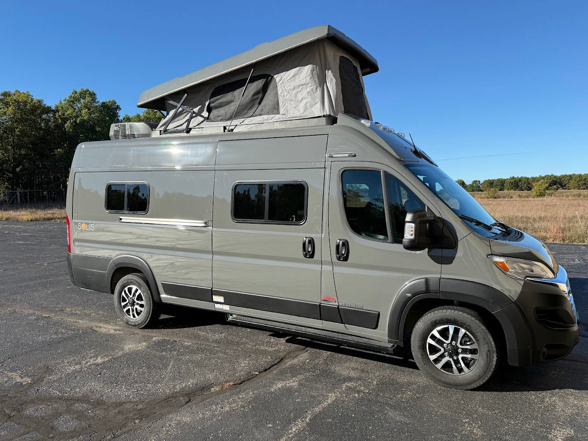  ideal for your next outdoor adventure.|This gray Winnebago Solis pop-top camper van is perfect for your next rv rental adventure.|Grey Winnebago Solis camper van