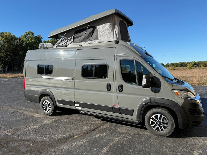  ideal for your next outdoor adventure.|This gray Winnebago Solis pop-top camper van is perfect for your next rv rental adventure.|Grey Winnebago Solis camper van — photo 1
