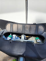 Open RV propane tank cover showing dual tanks & regulator. A key feature for your rv rental trip.