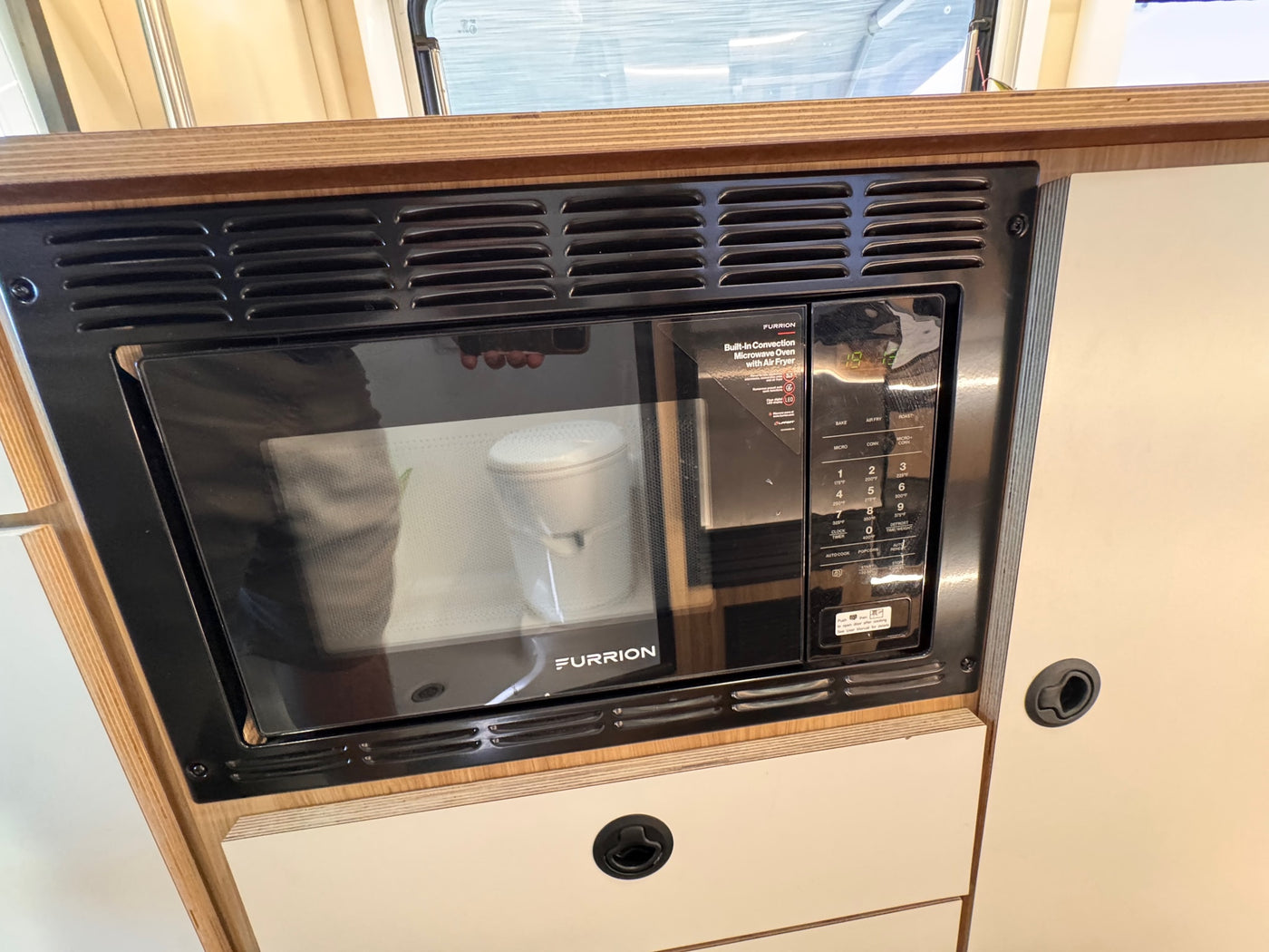 Enjoy versatile cooking in your rv rental with this Furrion built-in convection microwave oven with air fryer. — photo 18
